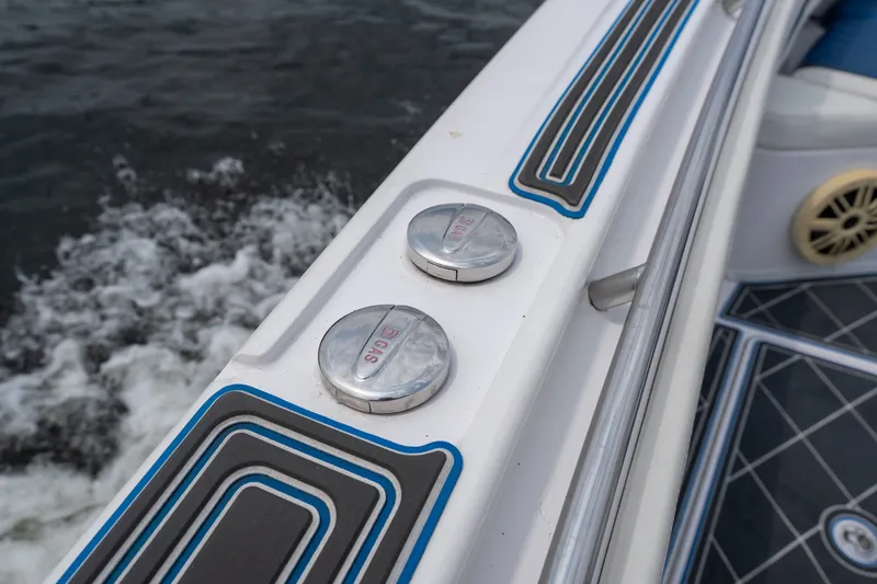Slide: The Image of 2018 Fountain 38 Center Console boat deck with gas cap and water splashes. - 20