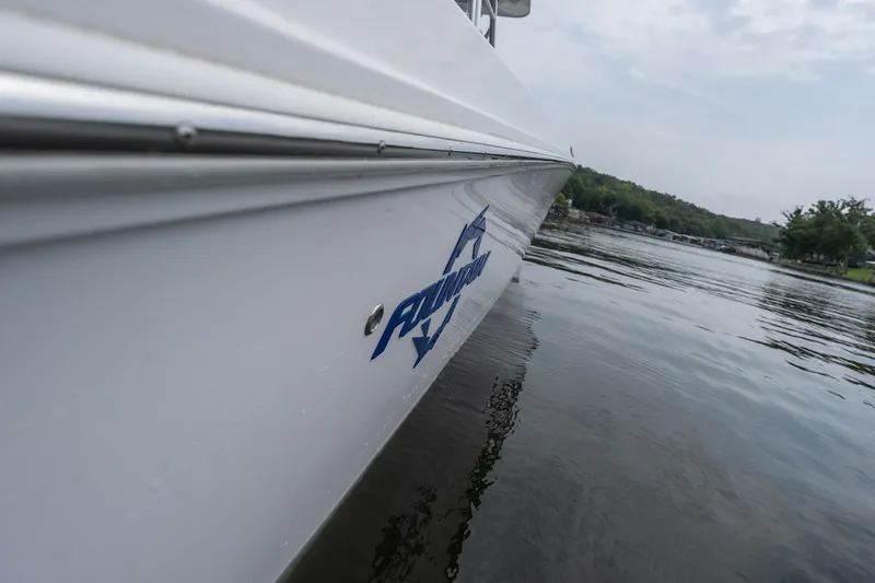 Slide: The Image of 2018 Fountain 38 Center Console boat on calm water, side view. - 46