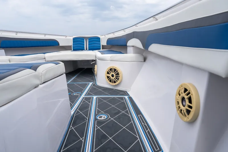 Slide: The Image of 2018 Fountain 38 Center Console boat interior with blue and white seating and stylish flooring. - 14