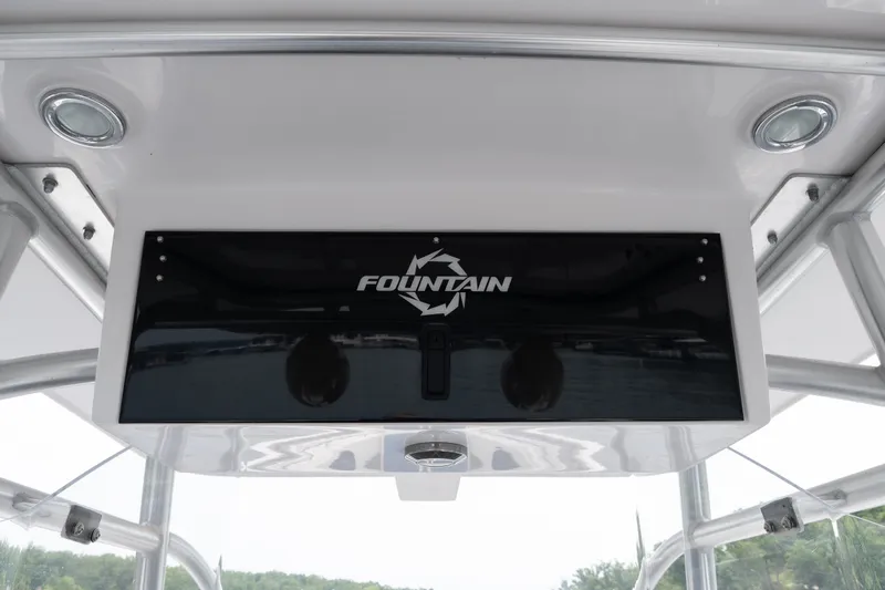 Slide: The Image of 2018 Fountain 38 Center Console boat dashboard with logo and sleek design. - 31