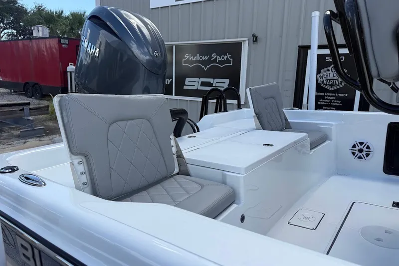 Slide: The Image of 2027 Blazer PureBay 2200 boat interior with gray seating and Yamaha engine. - 7