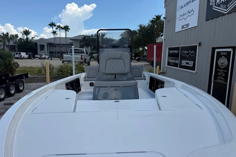 Slide: The Image of 2027 Blazer PureBay 2200 boat at marina, showcasing sleek design and spacious deck. - 3