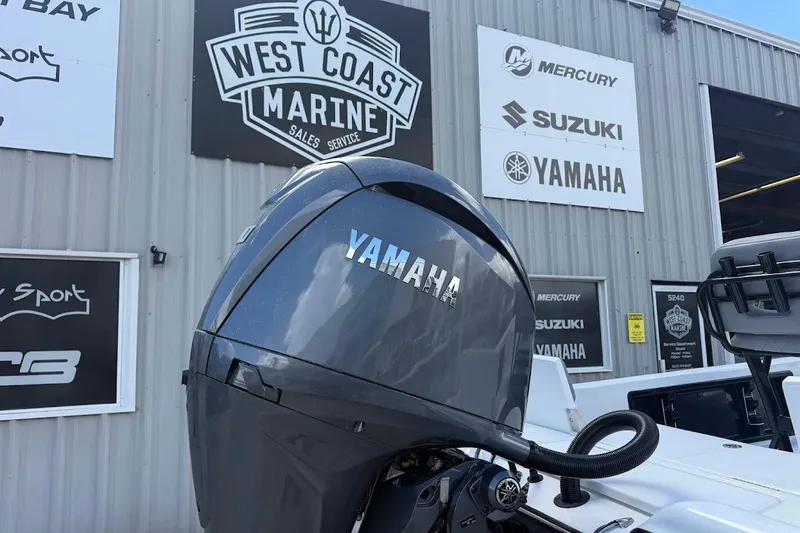 Slide: The Image of Yamaha outboard motor on Blazer PureBay 2200, 2027 model, at West Coast Marine dealership. - 12