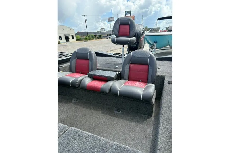 Slide: The Image of 2018 Ranger RT188 boat interior with red and gray seating, outdoor setting. - 10