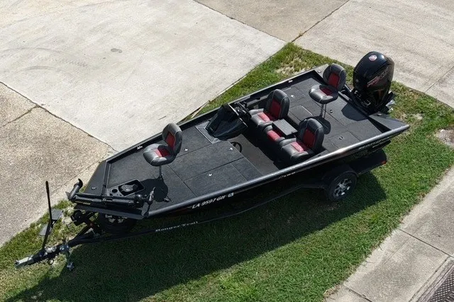 Slide: The Image of 2018 Ranger RT188 fishing boat on trailer, aerial view, parked on grass. - 1
