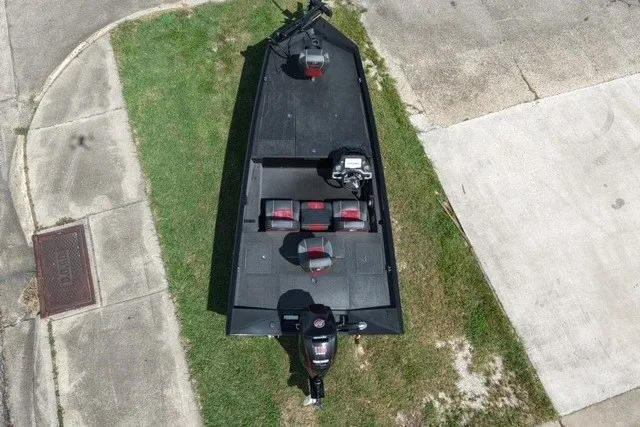 Slide: The Image of 2018 Ranger RT188 boat, aerial view, parked on grass and pavement. - 7