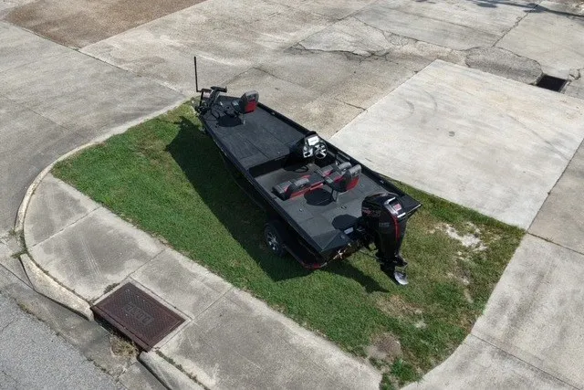 Slide: The Image of 2018 Ranger RT188 boat parked on grass, aerial view. - 6