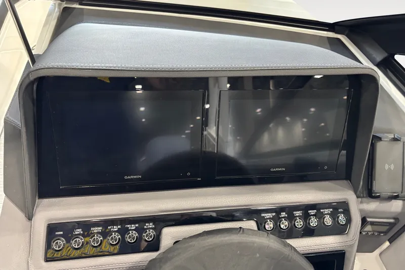 Slide: The Image of The image shows the dashboard of a Cobalt R4 boat with two Garmin screens. - 9