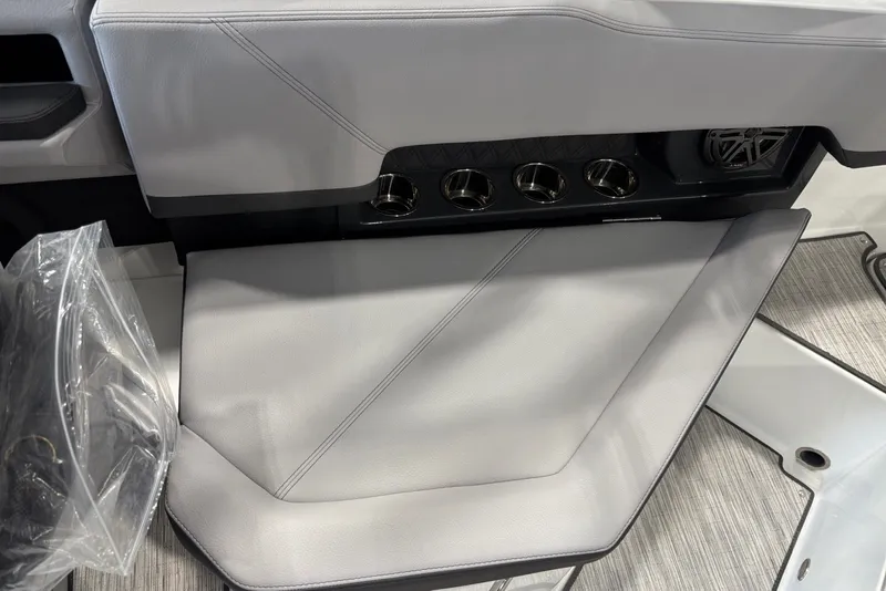 Slide: The Image of Interior of a Cobalt R4 boat with gray upholstery and cup holders. - 12