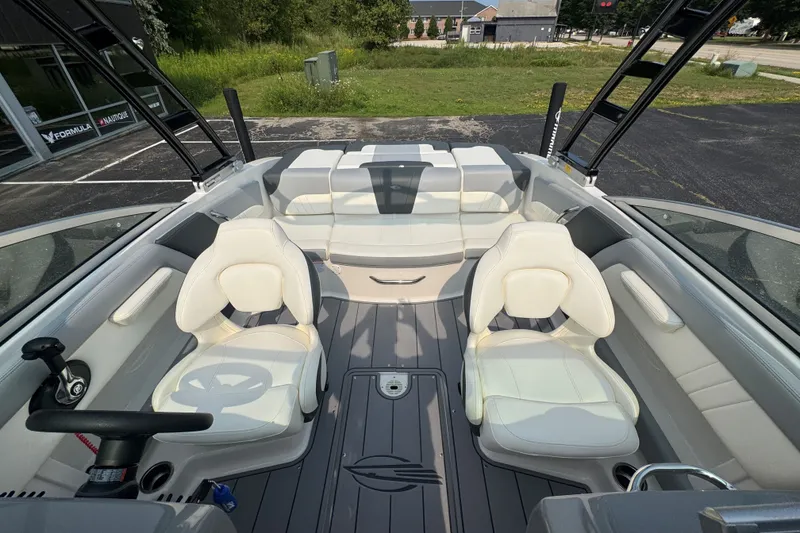 Slide: The Image of 2023 Chaparral 21 SSi boat interior with white seating and sleek design. - 32