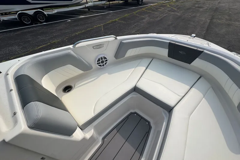 Slide: The Image of 2023 Chaparral 21 SSi boat interior with white and gray seating. - 15