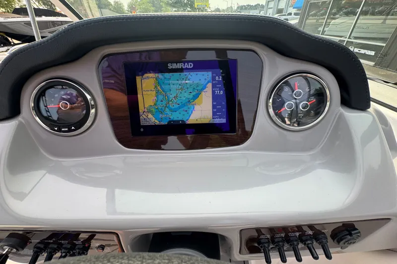 Slide: The Image of Dashboard of 2023 Chaparral 21 SSi boat with navigation display and gauges. - 26