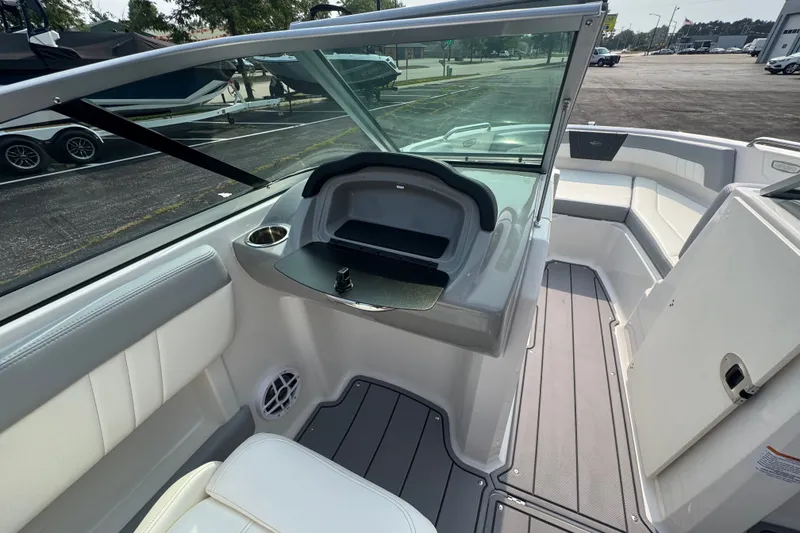 Slide: The Image of 2023 Chaparral 21 SSi boat interior with seating and storage compartments. - 25
