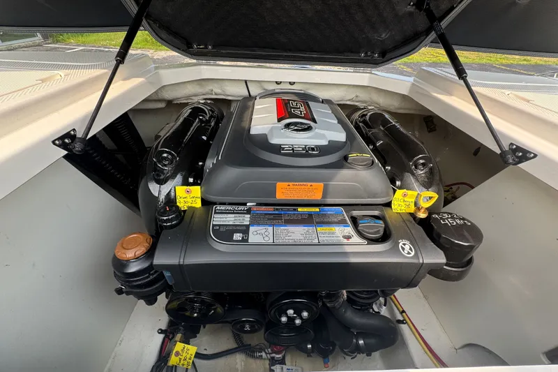 Slide: The Image of 2023 Chaparral 21 SSi boat engine compartment with Mercury 4.5L 250 HP engine. - 35