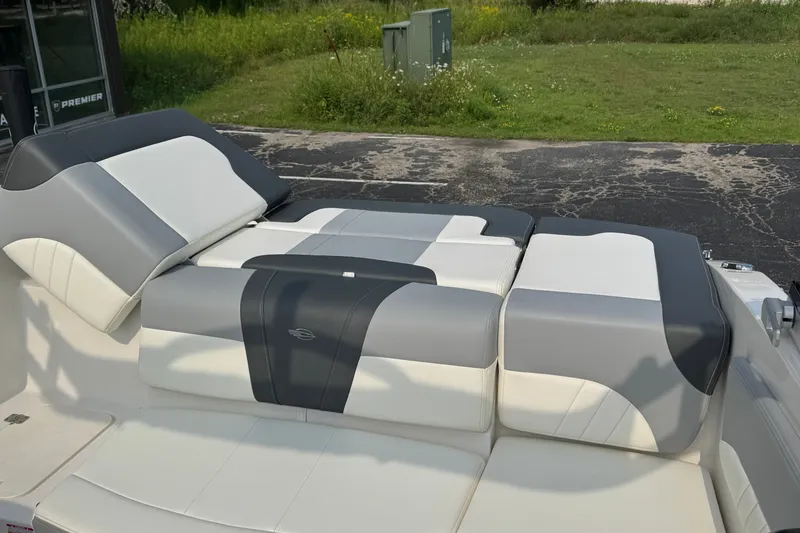 Slide: The Image of 2023 Chaparral 21 SSi boat interior with gray and white cushioned seating. - 33