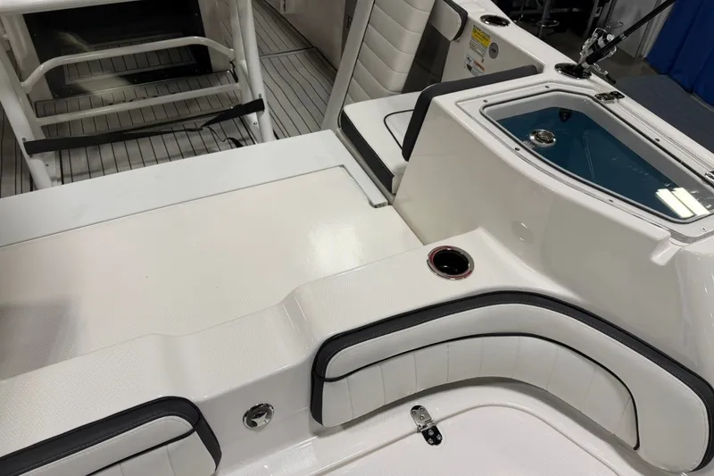 Slide: The Image of 2025 Yamaha Boats 255 FSH Sport E interior with seating and storage features. - 6