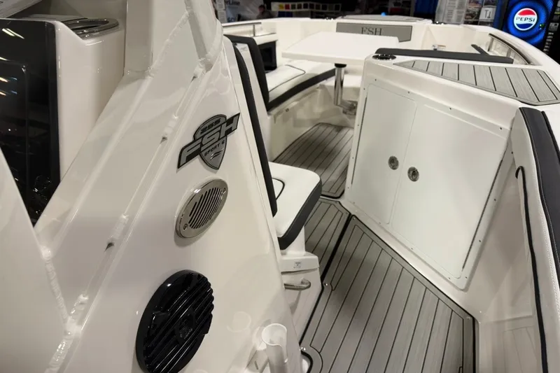 Slide: The Image of 2025 Yamaha Boats 255 FSH Sport E interior with sleek seating and modern design. - 12