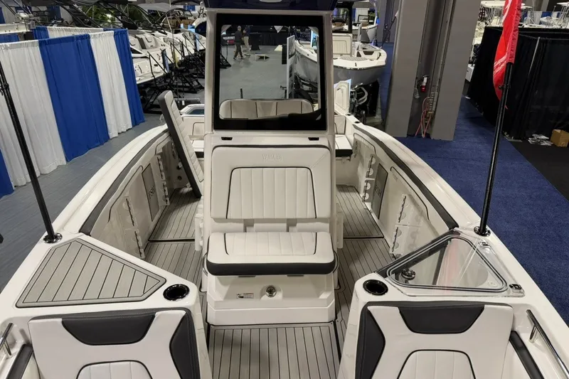 Slide: The Image of 2025 Yamaha Boats 255 FSH Sport E interior with sleek seating and modern design. - 19