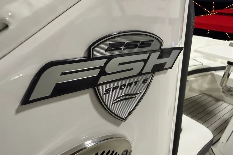 Slide: The Image of 2025 Yamaha Boats 255 FSH Sport E logo on sleek white surface. - 13