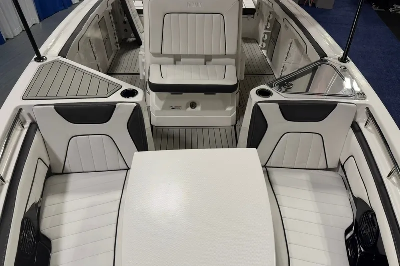 Slide: The Image of 2025 Yamaha Boats 255 FSH Sport E interior with sleek seating and modern design. - 18