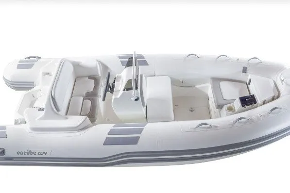 The Image of 2026 Caribe CL14 inflatable boat, white with seating and steering console, top view. - 0