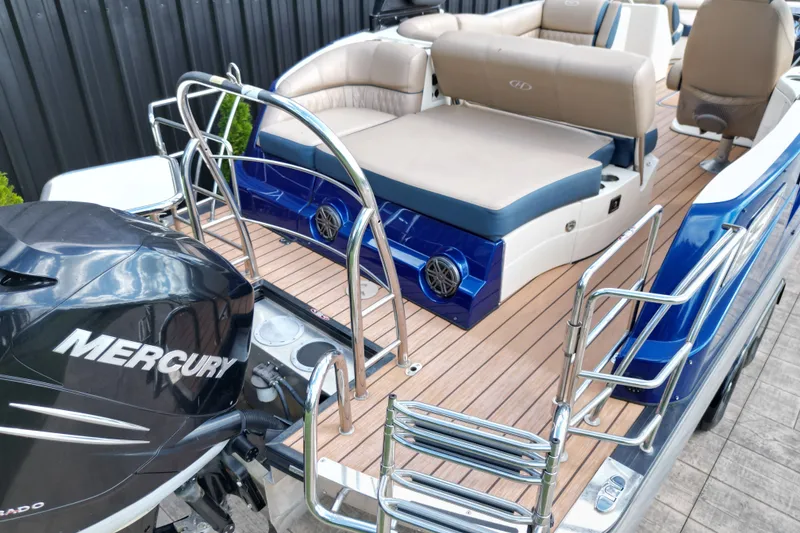 Slide: The Image of 2019 Harris Crowne SL 250 pontoon boat with Mercury engine and luxurious seating. - 15