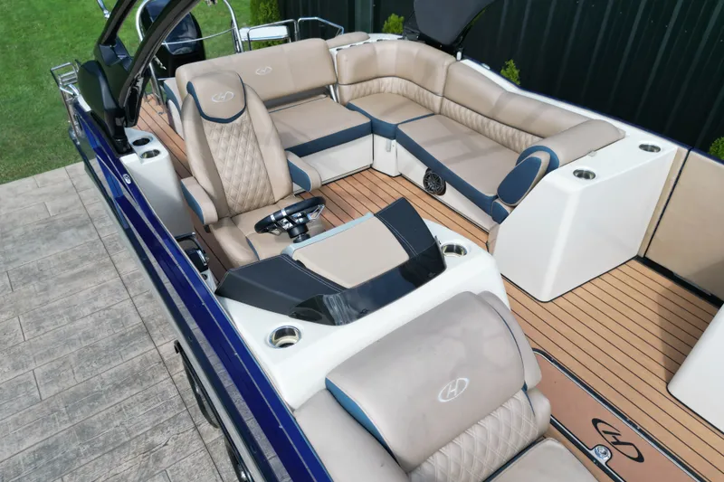 Slide: The Image of Luxurious interior of 2019 Harris Crowne SL 250 pontoon boat with plush seating and modern design. - 14