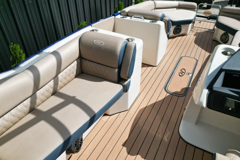 Slide: The Image of Luxurious seating on 2019 Harris Crowne SL 250 pontoon boat with elegant interior design. - 13