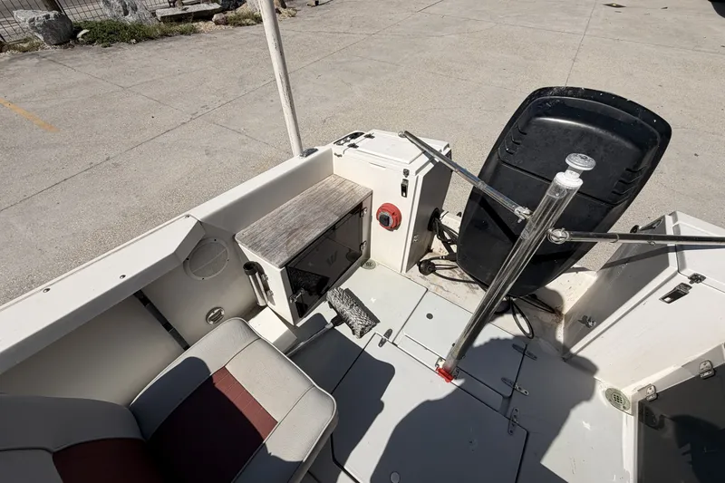 Slide: The Image of 1988 Wellcraft 200 Fisherman boat interior with seating and storage compartments. - 13