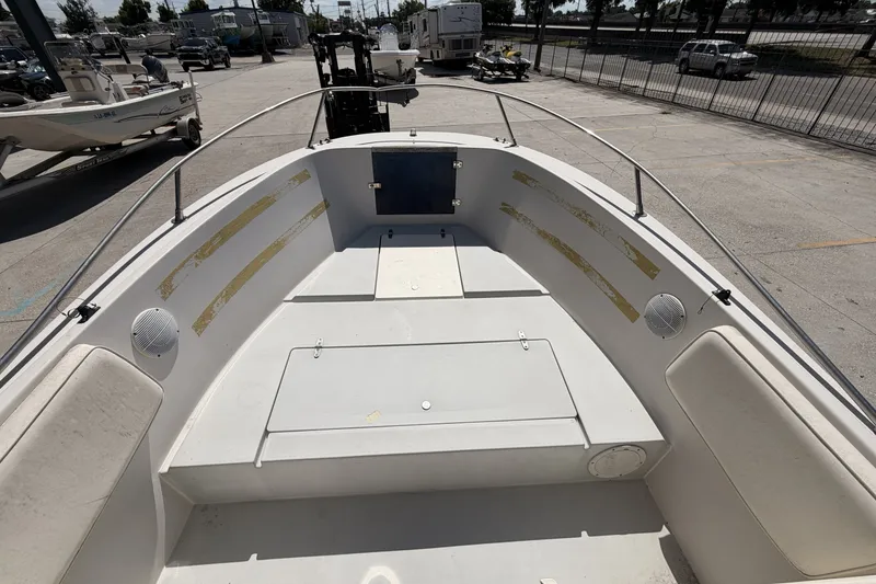 Slide: The Image of 1988 Wellcraft 200 Fisherman boat interior, featuring spacious seating and storage compartments. - 10