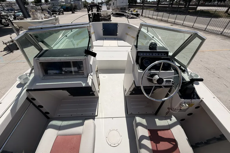 Slide: The Image of 1988 Wellcraft 200 Fisherman boat interior with steering wheel and seating. - 9