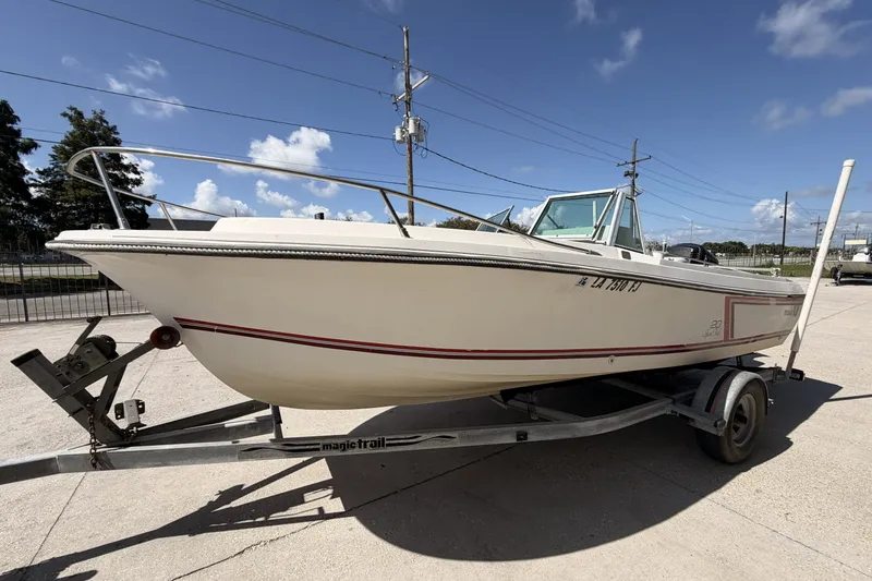 Slide: The Image of 1988 Wellcraft 200 Fisherman boat on trailer under clear blue sky. - 6