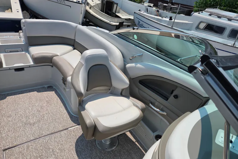 Slide: The Image of 2015 Crownline 255 SS boat interior with plush seating and modern design. - 20
