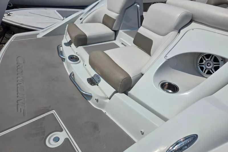 Slide: The Image of 2015 Crownline 255 SS boat interior with cushioned seats and speaker system. - 30
