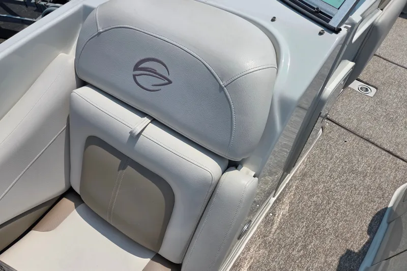 Slide: The Image of 2015 Crownline 255 SS boat interior with white leather seating and logo. - 22