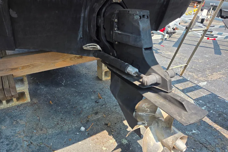 Slide: The Image of 2015 Crownline 255 SS boat outdrive and propeller on a trailer, close-up view. - 32