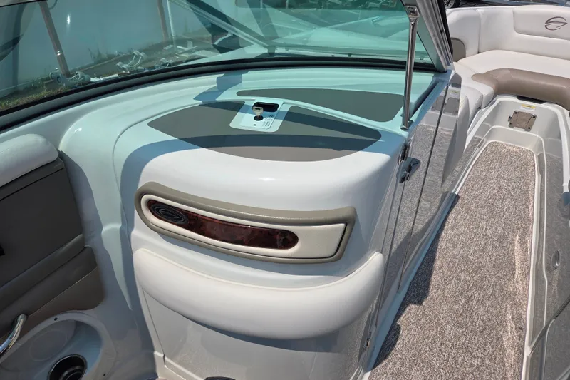 Slide: The Image of 2015 Crownline 255 SS boat interior with sleek design and comfortable seating. - 16