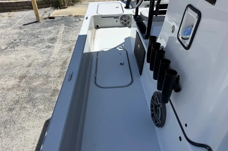 Slide: The Image of Shallow Sport 25 X3 2027 boat interior with rod holders and storage compartments. - 16