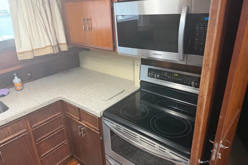 Slide: The Image of Kitchen area of 1981 Hatteras 56 Motor Yacht with stove and microwave. - 7
