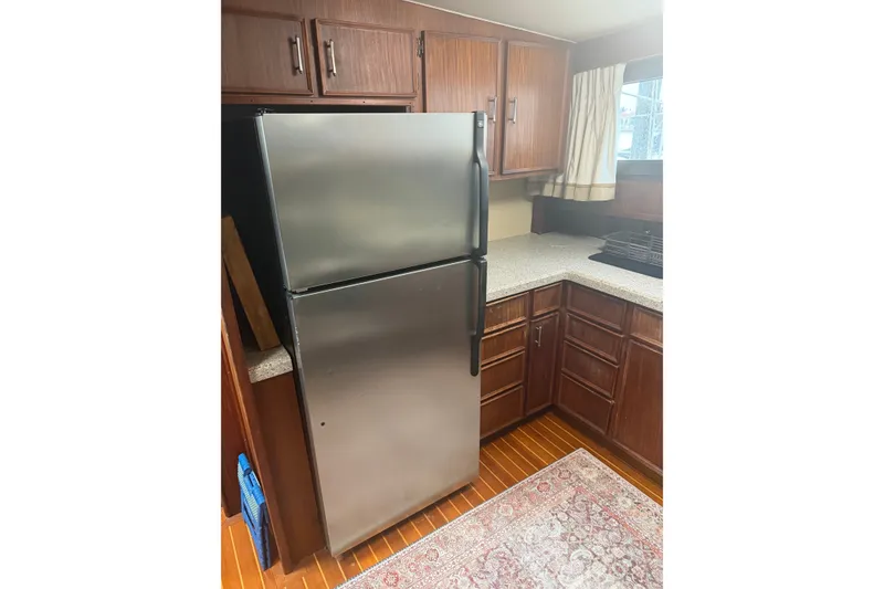 Slide: The Image of Kitchen area of 1981 Hatteras 56 Motor Yacht with stainless steel refrigerator. - 5
