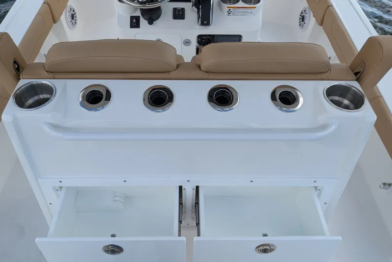 Slide: The Image of Interior of 2027 Caymas 28 HB boat with cup holders and storage compartments. - 6