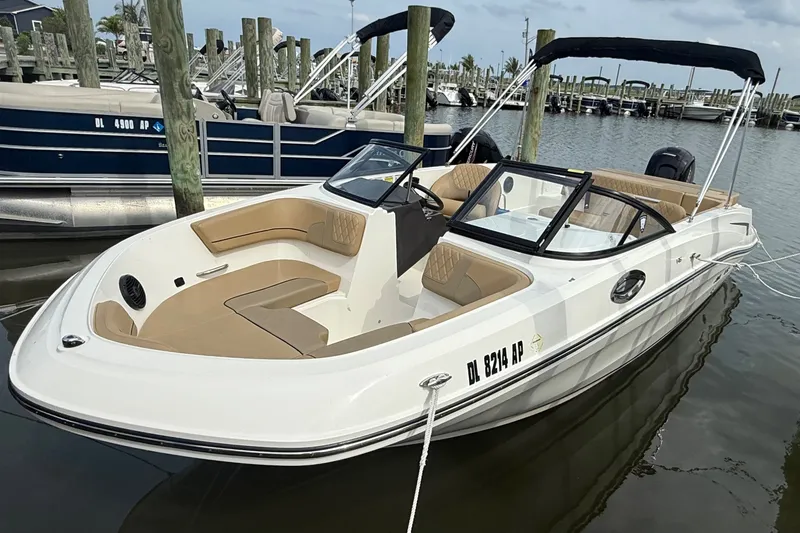 The Image of 2025 Bayliner VR6 Bowrider OB docked, featuring sleek design and spacious seating. - 1