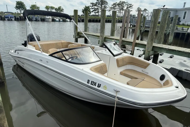 Slide: The Image of 2025 Bayliner VR6 Bowrider OB docked, featuring sleek design and spacious seating. - 3