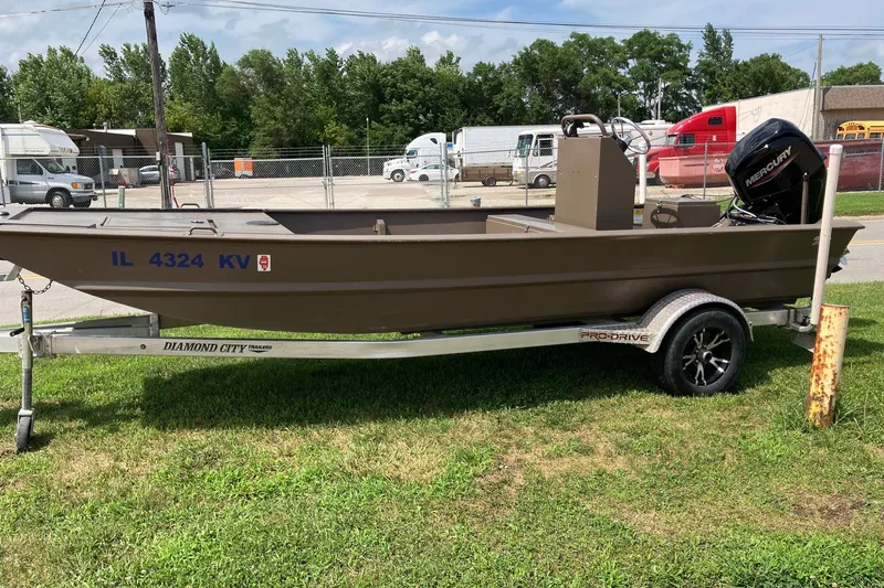 The Image of 2017 Pro-Drive SBX Series 18' boat on trailer, parked outdoors. - 0