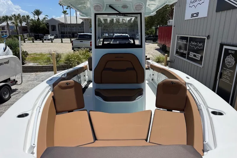 Slide: The Image of 2027 Sea Pro 245FLXR Sandbar boat interior with brown seating and modern design. - 3