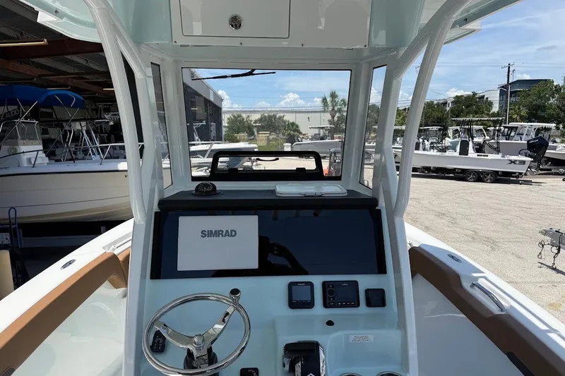 Slide: The Image of Interior view of 2027 Sea Pro 245FLXR Sandbar boat with Simrad navigation system. - 14