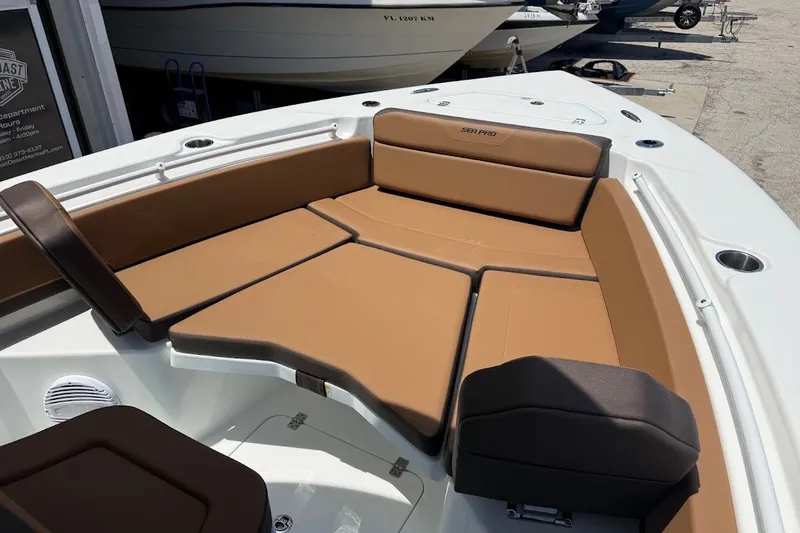Slide: The Image of 2027 Sea Pro 245FLXR Sandbar boat with tan seating and spacious deck layout. - 15