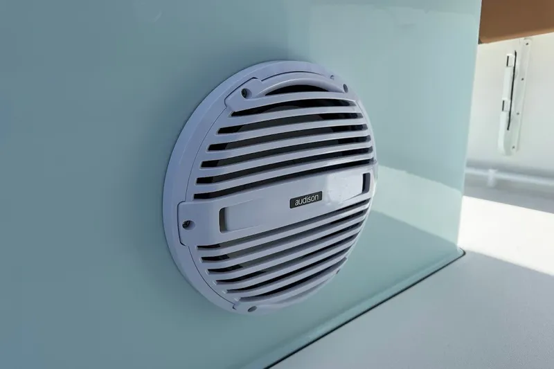 Slide: The Image of Audison speaker on 2027 Sea Pro 245FLXR Sandbar boat interior. - 19
