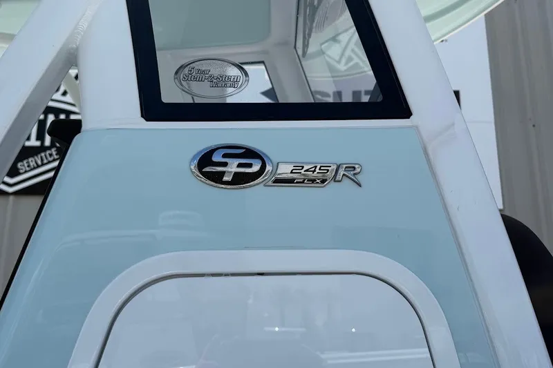 Slide: The Image of 2027 Sea Pro 245FLXR Sandbar boat emblem with warranty sticker. - 7