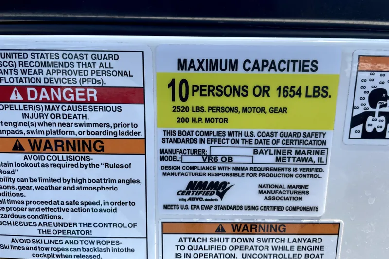 Slide: The Image of 2025 Bayliner VR6 Bowrider OB capacity label: 10 persons or 1654 lbs, 200 HP motor. - 8